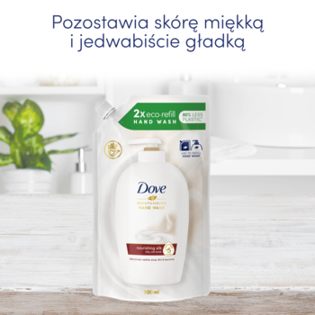 Widok z przodu zapasu Dove Nourishing Silk, mleczko nawilżające w białym opakowaniu z brązowym wzorem.