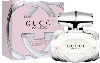Różowe opakowanie i fasetowana butelka damskiej wody toaletowej Gucci Bamboo z bambusowym korkiem. Widok z przodu.