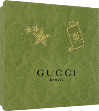 Zielone pudełko zestawu Gucci Guilty Pour Femme z logo "beauty" i złotymi gwiazdami, widok frontalny.