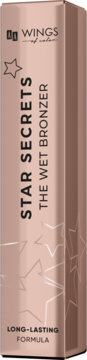 Różowozłote pudełko bronzera AA Wings of Color The Wet Bronzer, z napisem STAR SECRETS i gwiazdami, widok z przodu.