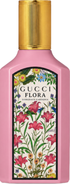Różowy flakon perfum Gucci Flora Gorgeous Gardenia ze złotym korkiem i etykietą w czerwone lilie i kwiaty, widok z przodu.