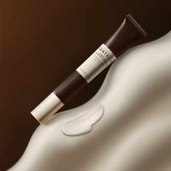 Krem pod oczy Skin 1004 Madagascar Centella Bakuchiol w brązowo-beżowej tubce, z wyciśniętym białym kremem na falistym tle.