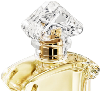Woda perfumowana Nahema, zbliżenie na butelkę z eleganckim złotym płynem i przezroczystym, rzeźbionym korkiem.