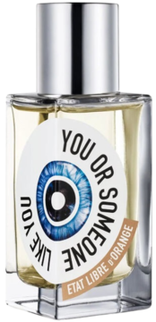 Perfumy Etat Libre d'Orange You Or Someone Like You, butelka z etykietą z okiem, srebrną nakrętką, cytrusowo-aromatyczne.