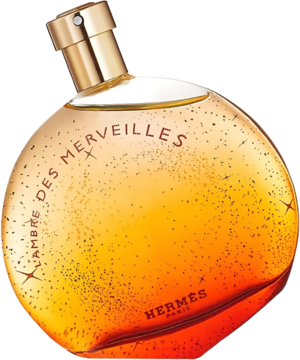 L'Ambre Des Merveilles Hermes: okrągła butelka wody perfumowanej, bursztynowy gradient z brokatem, złota zakrętka, widok z przodu.