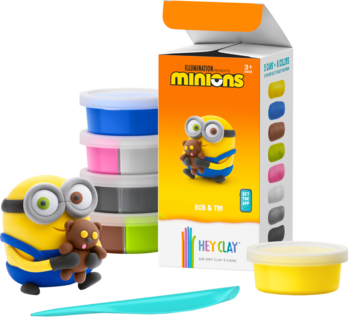 Hey Clay Minions zestaw do modelowania, z żółtą figurką Minionka, pudełkiem i różnymi kolorowymi masami.