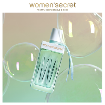 Perfumy damskie Women's Secret Intimate Daydream, zielona butelka, na pastelowym tle z przezroczystymi bąbelkami.