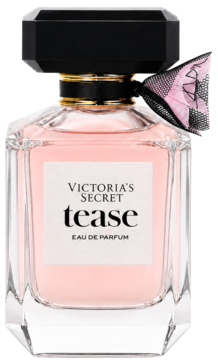 Victoria's Secret Tease EDP, różowe perfumy w fasetowanym flakonie z czarną nakrętką i różowo-czarną kokardą w kratkę.