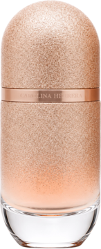Flakon perfum 212 VIP Rosé Elixir, błyszczący różowo-złoty, cylindryczny, z napisem Carolina Herrera, przodem.