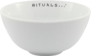 Biała, lśniąca miseczka Rituals z czarnym napisem "RITUALS..." wewnątrz, widok z góry pod kątem. Idealna do masek.