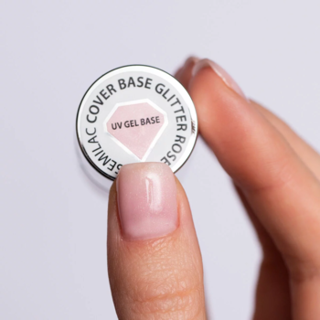 Semilac Skin Tone Cover Base UV Gel, mlecznoróżowa baza hybrydowa z brokatem, widok z góry na nakrętkę i palec.
