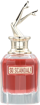 Jean Paul Gaultier So Scandal perfumy, czerwony płyn, złota nakrętka w kształcie nóg, widok z przodu.