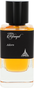 Paris Corner Rifaaqat Adorn woda perfumowana, czarna etykieta z białym napisem na bursztynowej butelce. Widok z przodu.