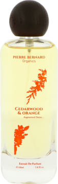 Pierre Bernard Organics Cedarwood & Orange Extrait De Parfum 100ml. Szklana butelka z brązowym korkiem i pomarańczowym roślinnym wzorem, widok z przodu.