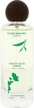 Pierre Bernard Organics Green Tea & Amber Extrait De Parfum. Przezroczysta butelka z zielonym napisem i wzorem liści.