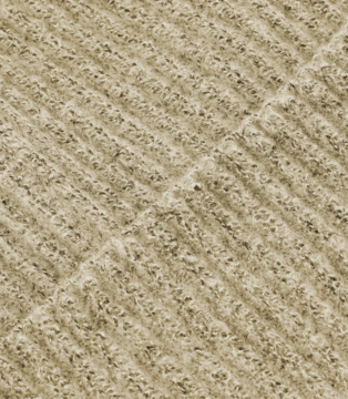 Close-up of a neutral beige textile, like carpet or knit fabric, showing a prominent diagonal ribbed texture.