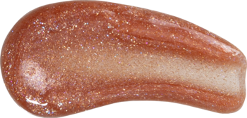 Zbliżenie na gęsty, brokatowy olejek Tuli Labs w odcieniu Amber Sparkle. Błyszcząca smuga mieniąca się bursztynem i złotem.