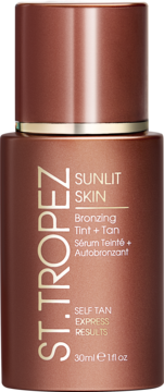 St. Tropez Sunlit Skin Bronzing Tint + Tan w brązowej butelce, widok z przodu, białe napisy.