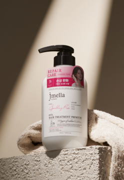 Jmella Sparkling Rose Premium, regenerująca odżywka do włosów zniszczonych w białej butelce z pompką, widok przód.