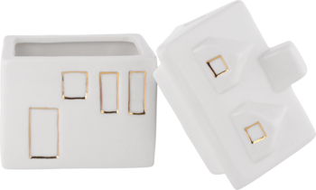 Białe ceramiczne domki dekoracyjne ze złotymi oknami, jeden jako doniczka, drugi leżący na boku, widok z góry.