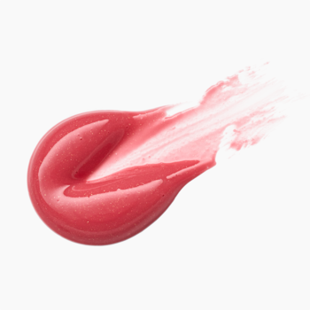 Pojedynczy rozmaz koralowego błyszczyka Catrice Diamond Glaze Gloss Stick Glow For It, szkliste wykończenie.