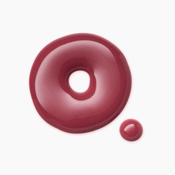 Błyszczyk Catrice Gloss Obsessed Pout Of Office, różowo-bordowy, lśniący, rozlany w kształt pierścienia na białym tle.