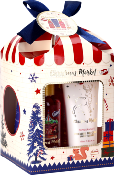 Zestaw Świąteczny Magic Christmas w kartonowym pudełku-namiocie, motyw "Christmas Market", widoczne czerwone i białe kosmetyki.