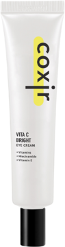 Biała tubka Coxir Vita C Bright Eye Cream z żółtym logo "coxir", widok z przodu. Na tubce napis VITA C BRIGHT EYE CREAM.