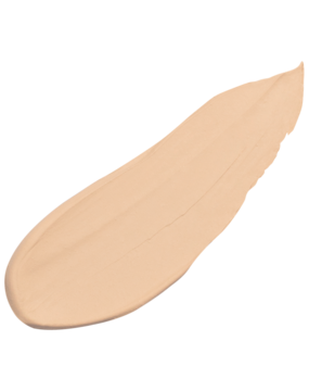 Kremowy korektor Lumene Blur Light, jasny odcień, nałożony w podłużną, diagonalną smugę, widok z bliska.