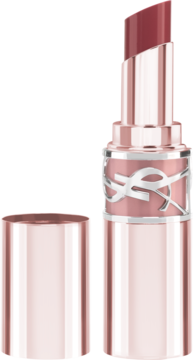 Otwarty balsam koloryzujący YSL Love Shine 44B Nude Lavallière, w rose gold, z wysuniętym sztyftem, na ciemnym tle.