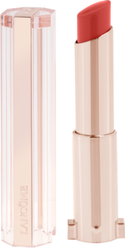 Koralowa pomadka Lancôme Idôle Squalane-12 Butterglow, otwarta, w błyszczącej miedzianej tubce, z przezroczystą zatyczką.
