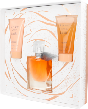 Zestaw Lancôme La Vie Est Belle: bursztynowy perfum i dwa balsamy w białym pudełku ze złotym wzorem, widok z góry.