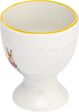Biały ceramiczny kieliszek na jajko z żółtym brzegiem i grafiką Królika Piotrusia, widok z boku pod kątem.