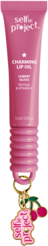 selfie project. Charming Lip Oil Cherry Gloss w różowej tubce z breloczkiem i wiśniami, widok z przodu.