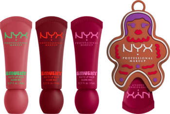 NYX Holiday Smushy Kit: trzy matowe błyszczyki (zielony, czerwony, magenta) i brązowy brelok-piernik na tle gradientu.