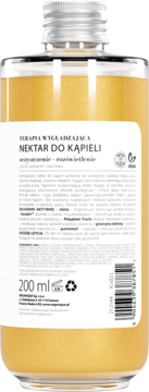 Tył butelki Organique Nektar do Kąpieli Eternal Gold 200 ml z pomarańczowym płynem i białą etykietą, widok z tyłu.