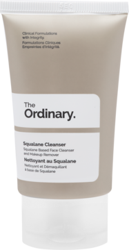 The Ordinary Squalane Cleanser, jasnobeżowa tubka z białą nakrętką, widok z przodu. Delikatny środek do demakijażu.