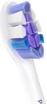 Końcówka Philips Sonicare S2 Sensitive Extra Soft, z białymi, fioletowymi, niebieskimi włóknami. Zbliżenie.