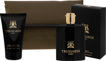 Zestaw Trussardi Uomo: czarny flakon perfum, tuba balsamu i kartonik na ciemnym tle. Widok z przodu.