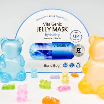 Białe opakowanie maski Banobagi Vita Genic Jelly Mask Hydrating (Vitamin E), z motywem kapsułki, otoczone kolorowymi żelkami.