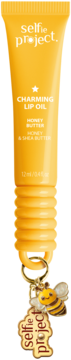 Żółty Selfie Project Charming Lip Oil z miodem i masłem shea, z uroczą zawieszką w kształcie pszczoły.