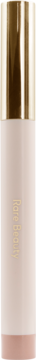 Rare B. All Weightless Eyeshadow Stick Adventure. Złota, błyszcząca nakrętka i pionowe, bladoróżowe opakowanie.