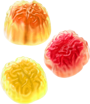 Trzy żelki Brainfood w kształcie mózgu: żółty, pomarańczowy, czerwony, z glukozą i kwaśnym nadzieniem, na czarnym tle.