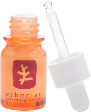 Erborian Korean Skin Therapy serum pod oczy w otwartej pomarańczowej butelce z pipetą, widok z bliska.