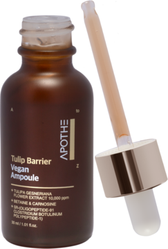 Apothe Tulip Barrier Vegan Ampoule, butelka z ciemnego szkła, z wyjętą pipetą pełną beżowej ampułki.