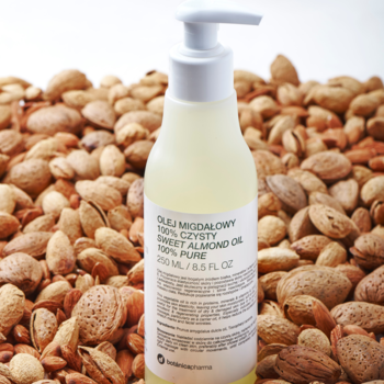 Olej migdałowy 100% czysty w butelce z pompką na tle migdałów. Do skóry i włosów, 250 ml.