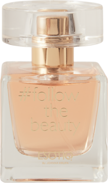 Woda perfumowana Joanna Krupa #follow the beauty w kwadratowej butelce z jasnym płynem i złotym napisem.