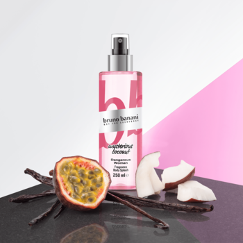 Mgiełka do ciała Bruno Banani Dangerous Woman 250ml, różowa butelka, obok wanilia, kokos, marakuja.