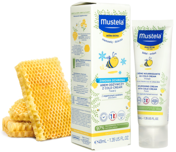 Mustela Cold Cream dla dzieci w białym pudełku i tubce, obok leży stos złocistych plastrów miodu.