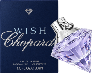 Chopard Wish woda perfumowana dla kobiet w fioletowej, diamentowej butelce obok granatowego pudełka, pod kątem.